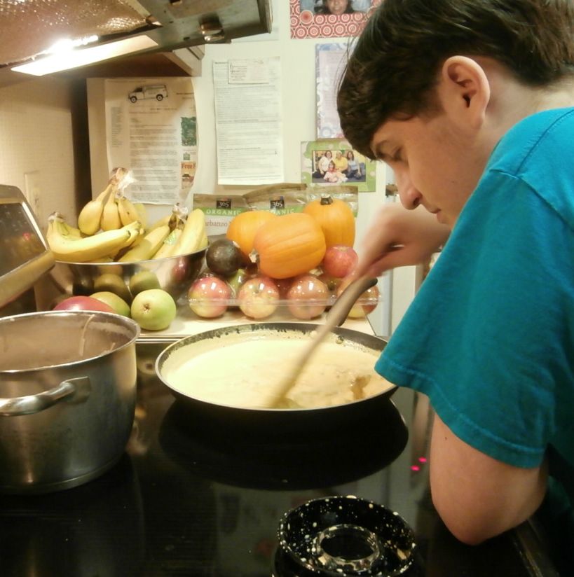 my oldest son, stirring the cheese sauce