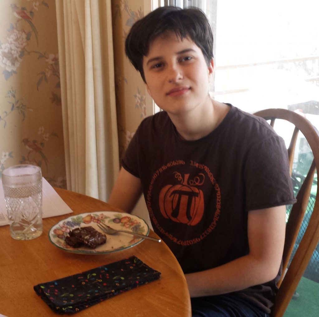 My son James, wearing a Pumpkin Pi shirt and eating Pi Pie. :)