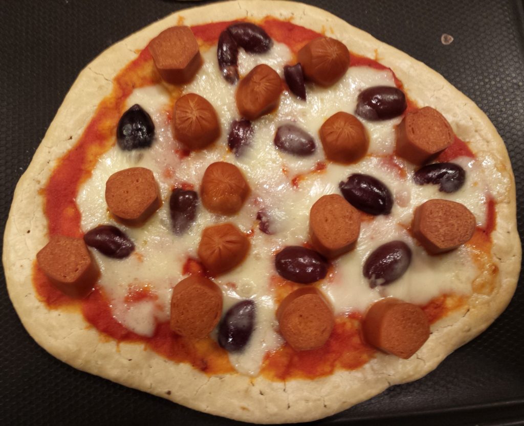 Pizza four! Made by my teen who likes olives, veggie dogs, and cheese.